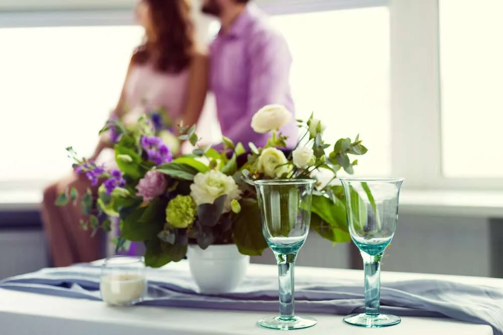 Romantic wedding dinner rehearsal setup with fresh flowers
