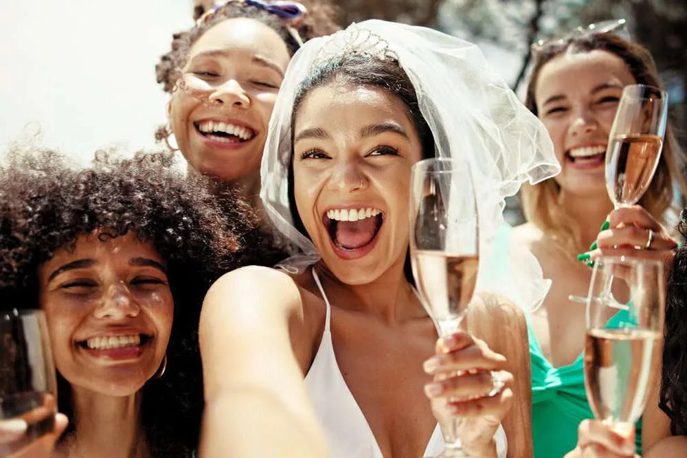 Selfie, champagne and bachelorette party with women at hotel for summer, celebration and holiday. Travel, portrait and bridal shower with group of friends at resort for memories, vacation and support.