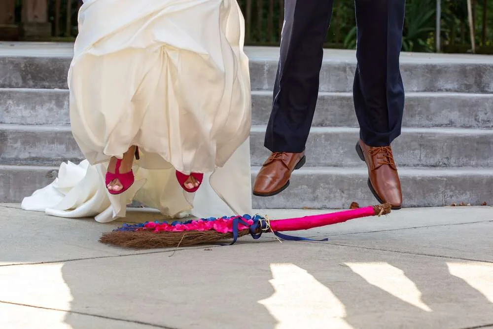 Wedding Tradition: Bride and Groom Jumping the Broom Ceremony
