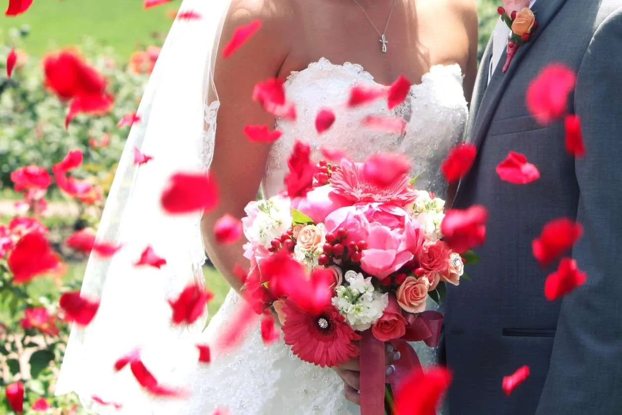 Couple celebrating their wedding on Valentine's Day with Valentine's Day themes.